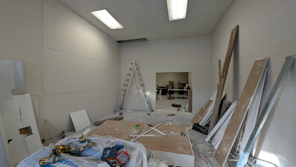 Drywall installation underway in a room, with sheets ready for mounting, provided by GCB Home Improvement in Appleton, WI.