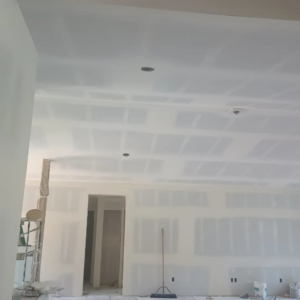 An interior room with newly installed drywall, taped and mudded, showing a handyman job by JLSL Drywall LLC in Salem, OR.