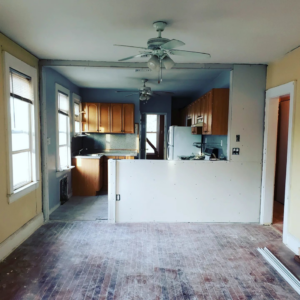 Drywall being installed on a kitchen half-wall during renovation by CJM Builders Inc in Wilmington, MA.