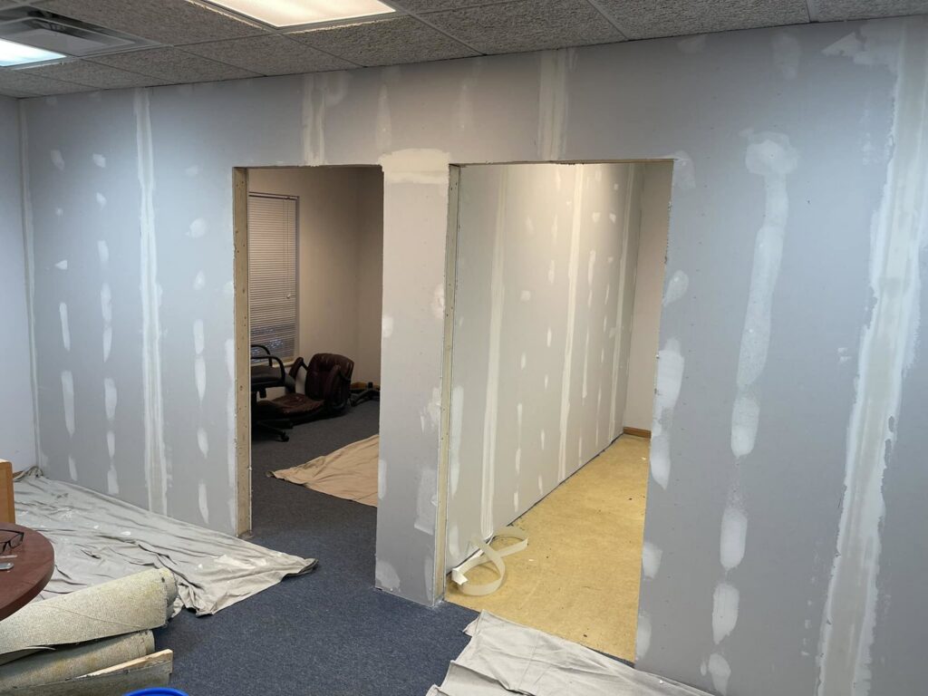 New drywall installed and taped in an office space by S-Squared Construction in Madison, WI.