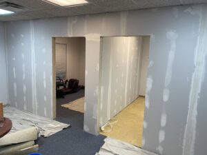 New drywall installed and taped in an office space by S-Squared Construction in Madison, WI.