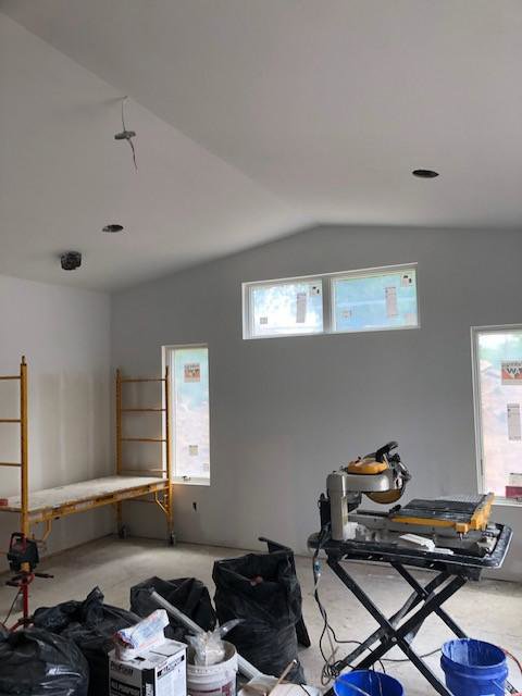 Drywall installation and renovation with scaffolding and tools by Farnsworth Interiors Drywall and Plaster in Akron, OH