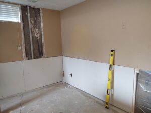 Partial drywall installation and repair in a room, showcasing services by IFixdIt Handyman Services in Omaha, NE.