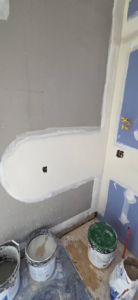 Drywall installation and repair in progress with materials on the floor by AJ's Drywall & Finishing, LLC in St. Louis, MO.