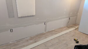 Drywall mudding and taping in progress on an interior wall by SurePlan Handyman in North Ogden, UT