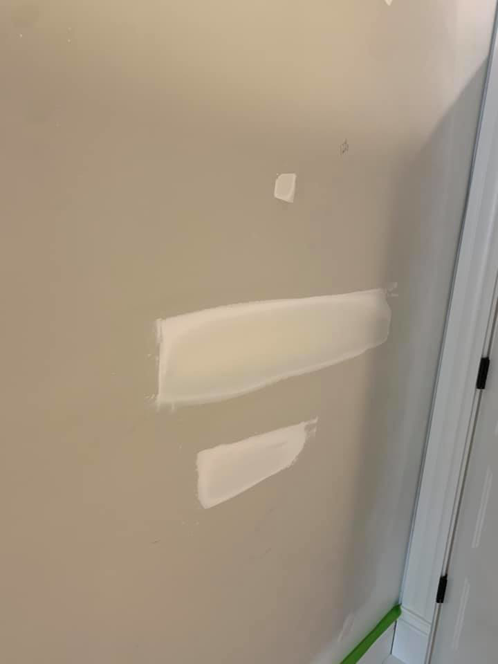 Fresh drywall patches on a wall, indicating repair work by Walrus Rock Construction LLC in Pacific, MO.