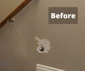 Before photo of a wall with a large hole needing drywall repair by Sir Fix-A-Lot Handyman Services, LLC in Palmer, AK.
