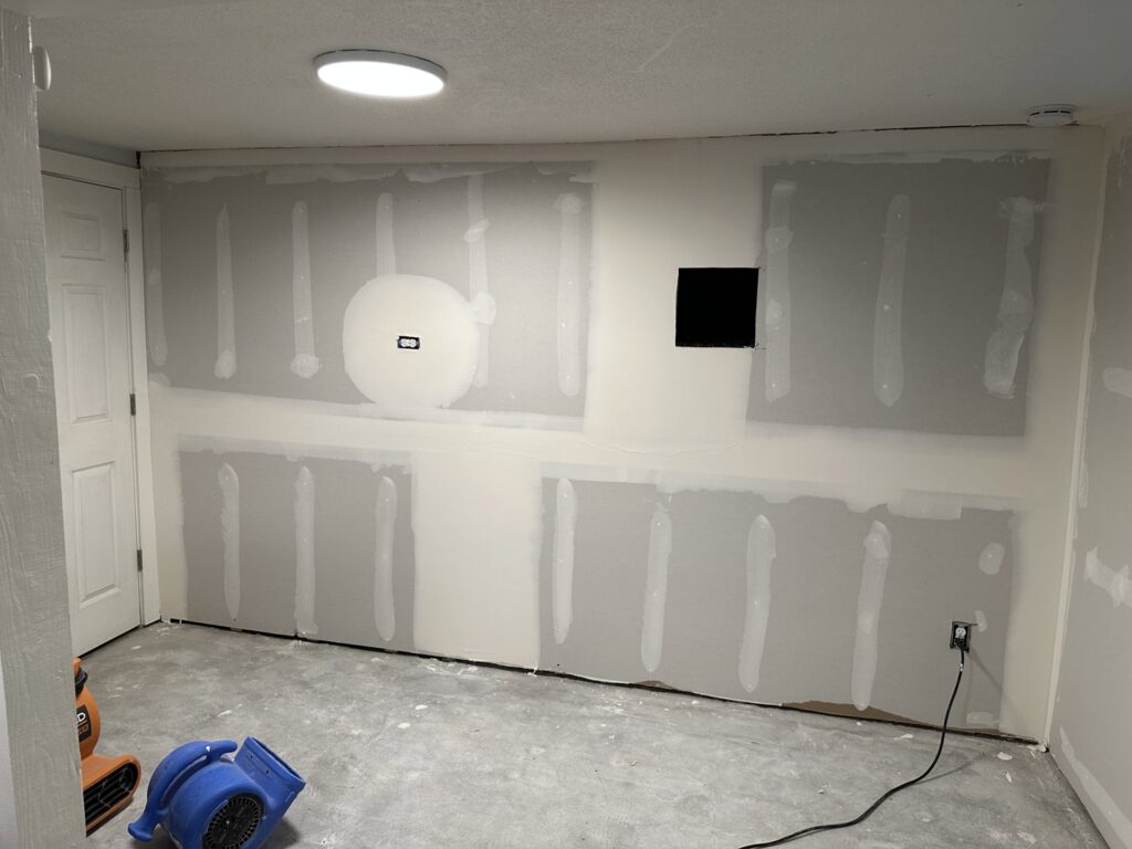 Drywall repair and installation in a room by Denver House Repair in Lakewood, CO.