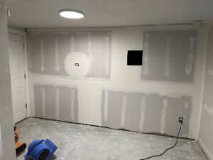Drywall repair and installation in a room by Denver House Repair in Lakewood, CO.