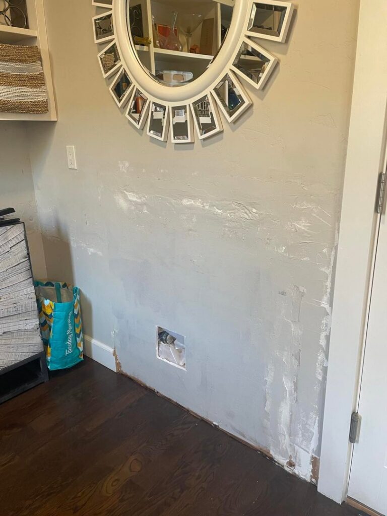 A wall undergoing drywall repair and patching, a typical interior handyman service by FES handyman services LLC in Boise, ID.
