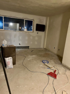A room in progress with drywall repairs and renovation materials, handled by Get It Done in Sioux Falls, SD.