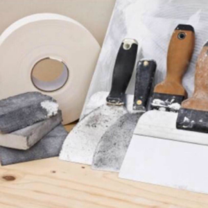 Drywall repair tools including tape, sanding blocks, and knives, representing services offered by Charleston Home Repairs & Handyman Services in Summerville, SC.