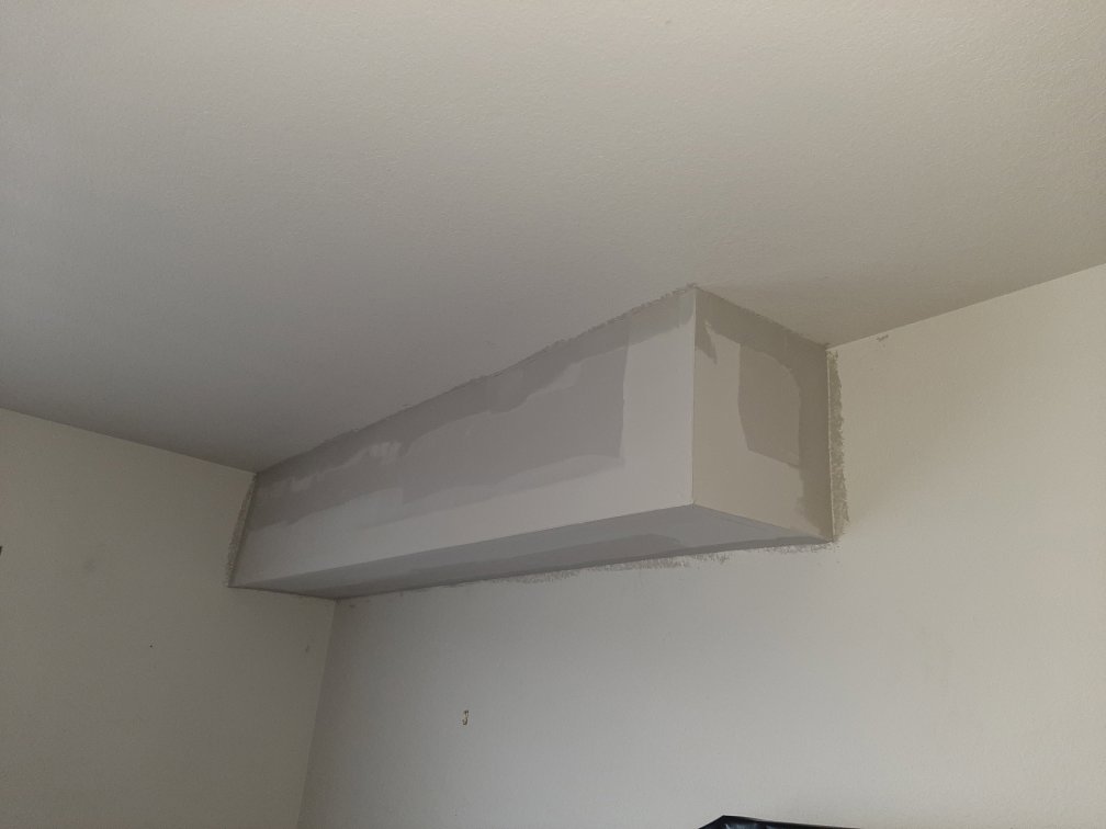 A newly installed and finished drywall soffit on a ceiling by HandyVets in Saint Charles, MO.