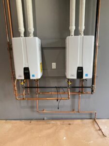 Two tankless water heaters professionally installed with copper piping by Read Plumbing LLC in Ankeny, IA.