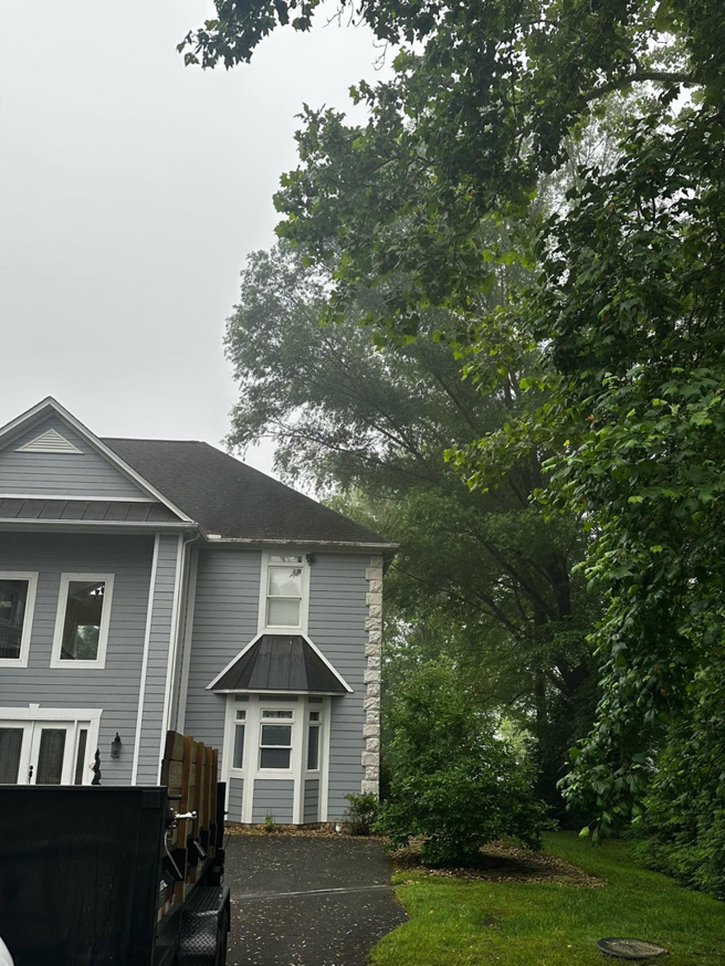 A dump trailer parked at a residential property, ready for tree service debris removal by ClearTree LLC in Joppa, MD.