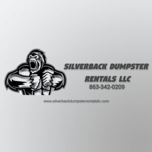A Silverback Dumpster Rentals dump trailer actively dumping construction waste and debris at a site in LaBelle, FL.