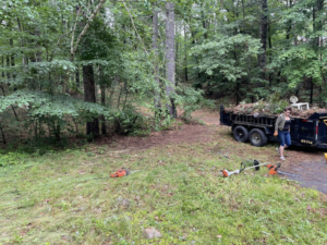 A dump trailer filled with brush and yard waste, ready for hauling by Mr. Property Service in Sanford, ME.