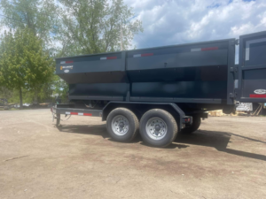 A large, empty dump trailer used for junk removal services by Westover Trash Removal in Springfield, MA.