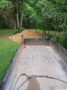 A dump truck bed ready for or after hauling dirt for JDS Home Improvement in Gaithersburg, MD.