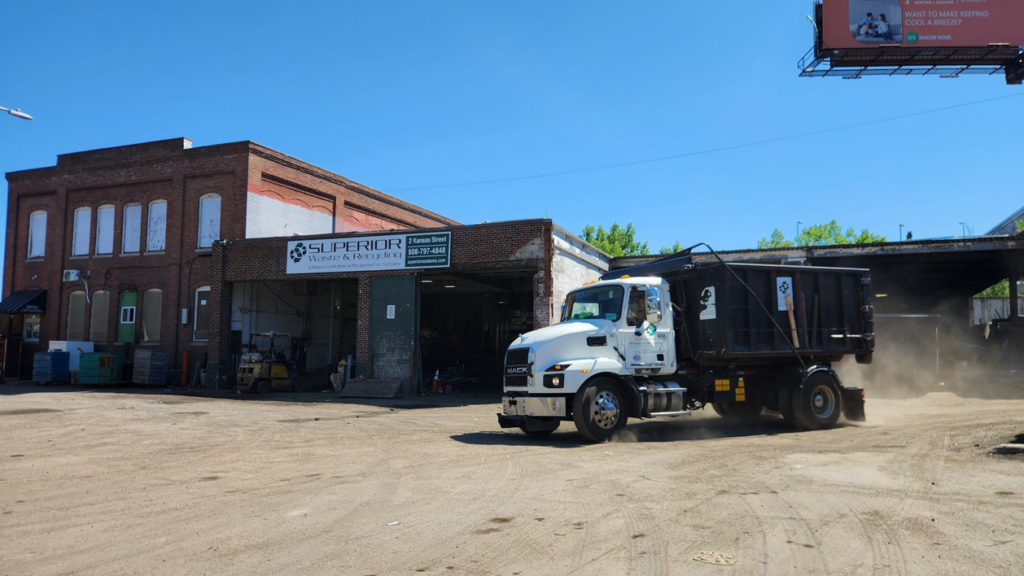 A Superior Waste and Recycling dump truck leaving the facility in Worcester, MA.