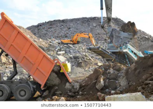 A dump truck unloading construction debris at the recycling facility of Global Recycling of Tampa Bay in Tampa, FL.
