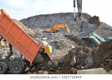 A dump truck unloading construction debris at the recycling facility of Global Recycling of Tampa Bay in Tampa, FL.