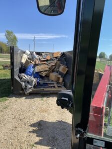 An interior view of a SpudCity Dumpsters roll-off bin filled with construction debris in Caldwell, ID.
