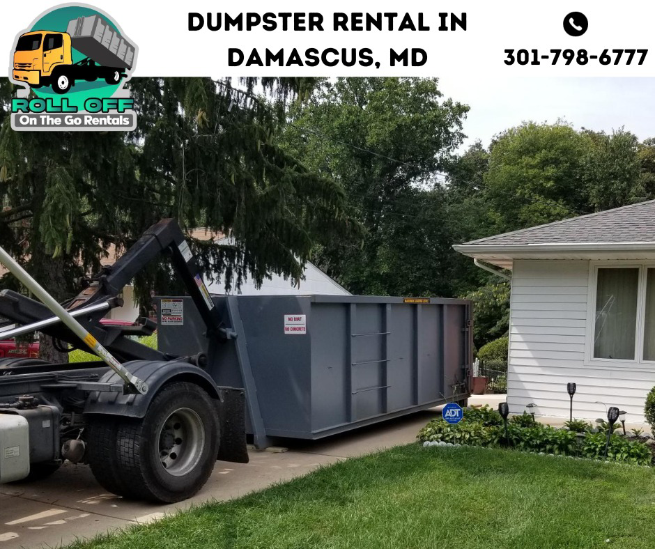 A roll-off dumpster being delivered to a residential driveway by Roll Off On the Go Rentals in Silver Spring, MD.