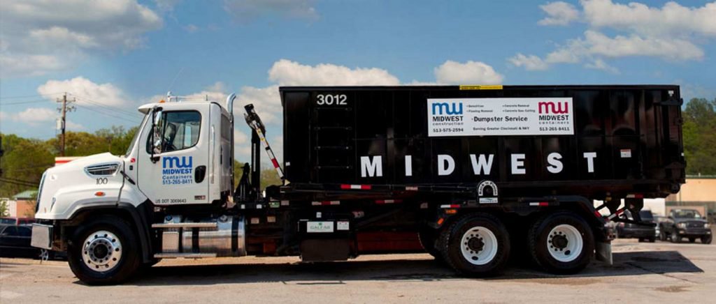 A Midwest Containers roll-off truck with a dumpster clearly labeled for dumpster service and junk removal in Cincinnati, OH.