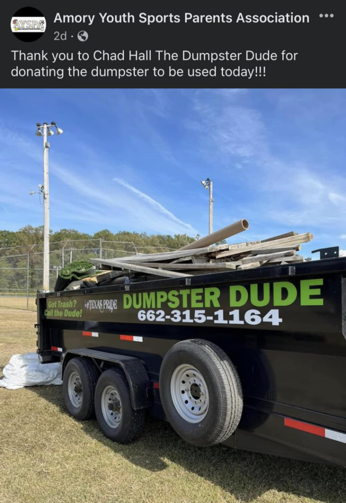 A Dumpster Dude trailer filled with various junk and construction debris after a successful cleanup in Amory, MS.