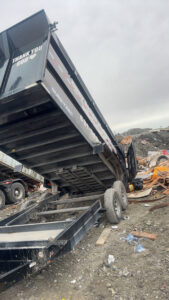 A Greybeard Dumpster Rentals trailer unloading a load of junk at a landfill in Morgantown, WV.