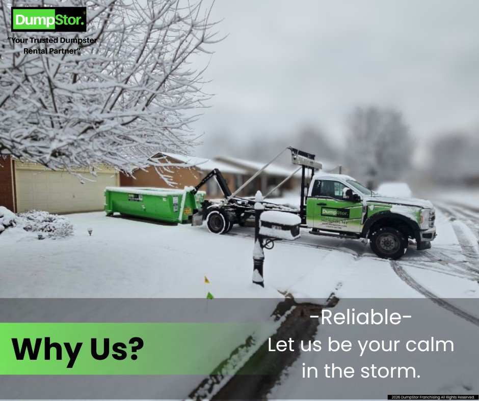 A DumpStor of Louisville truck delivering a green dumpster to a snowy residential neighborhood in Louisville, KY.