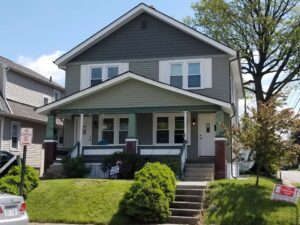 Exterior view of a duplex with newly installed windows and siding by The Window Man of Ohio in Westerville, OH.