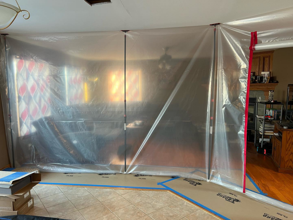 Plastic sheeting set up for dust containment during a remodeling project by Silhouette Builders, Inc. in Yorkville, IL