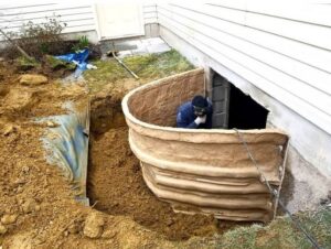 Excavation for an egress window or basement entrance at a home by Foundation Repair and Waterproofing in Philadelphia, PA.