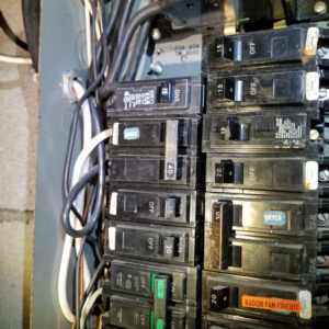 A close-up view of an electrical panel with circuit breakers, a service offered by Paul's Handyman Solutions in Lexington, KY.