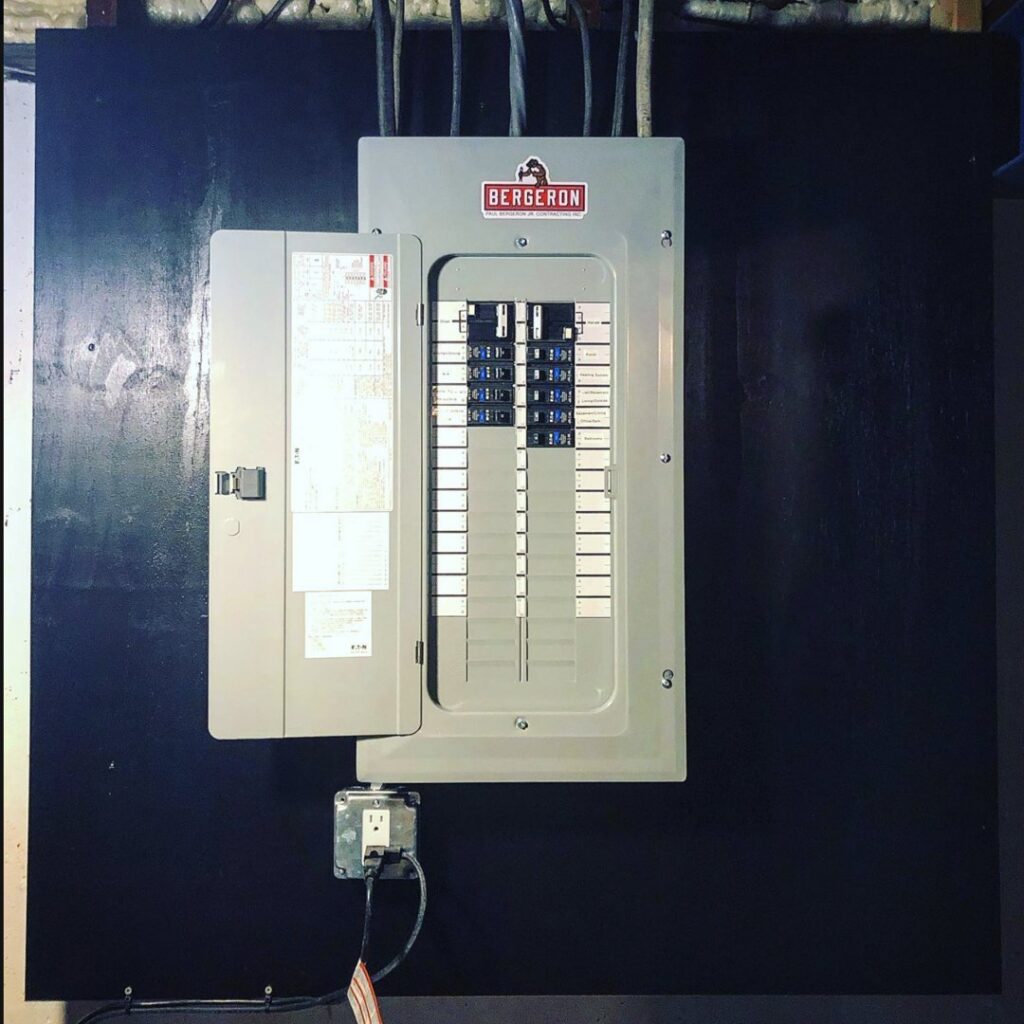 A newly installed electrical panel (breaker box) on a wall by Paul Bergeron Jr. Contracting Inc. in Worcester, MA