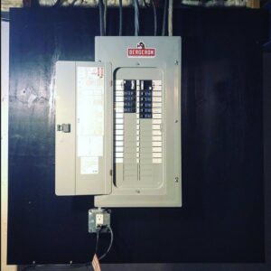 A newly installed electrical panel (breaker box) on a wall by Paul Bergeron Jr. Contracting Inc. in Worcester, MA