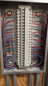 A neatly wired electrical panel with circuit breakers by DemoCraft Commercial Services in Everett, WA