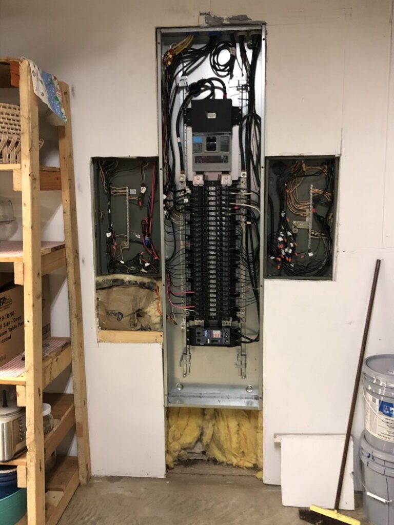 An open electrical panel showing extensive wiring, indicating electrical services by HandyVets in Saint Charles, MO.