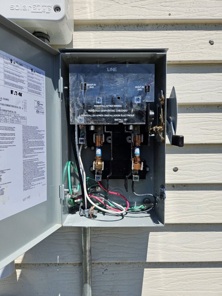 Close-up of an open electrical panel with wiring being installed by Paramount Development in Milwaukee, WI.