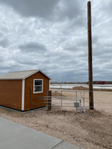 Electrical wiring and utility pole setup for an outbuilding by Harvey's Electric in Perryton, TX