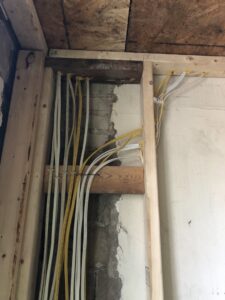 New electrical wiring bundles installed within wall framing during construction by AES Electrical Contractor in Richmond, VA.