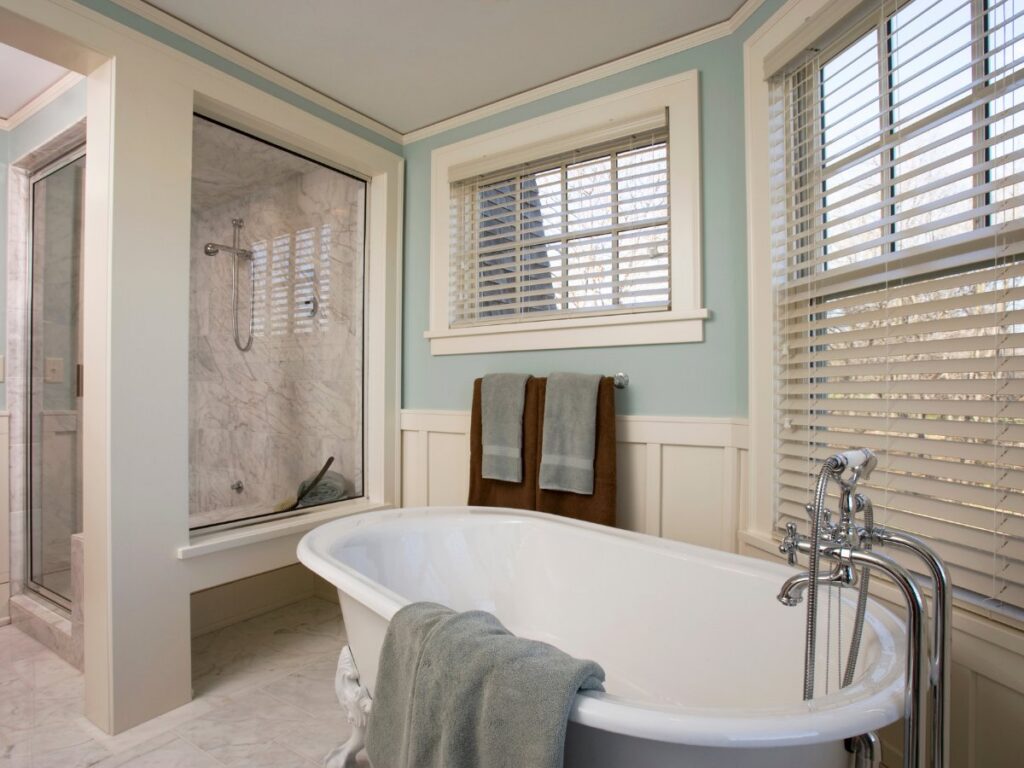 An elegant bathroom remodel featuring a freestanding tub and a glass shower enclosure by FEARS Construction in Nashville, TN.