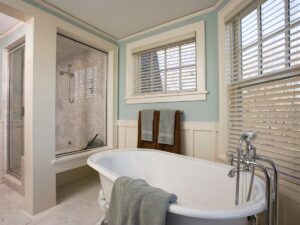An elegant bathroom remodel featuring a freestanding tub and a glass shower enclosure by FEARS Construction in Nashville, TN.