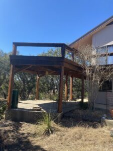 Newly constructed elevated wooden deck structure by Vargas Paint and Texture in San Antonio, TX.