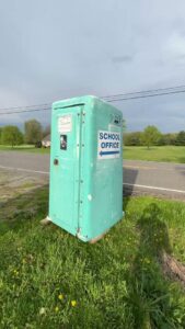 An employee of Black Diamond Junk Removal removing a large water heater in Bedford Heights, OH.
