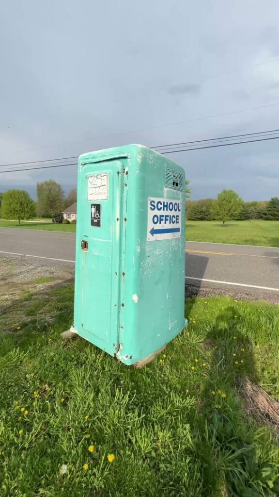 An employee of Black Diamond Junk Removal removing a large water heater in Bedford Heights, OH.
