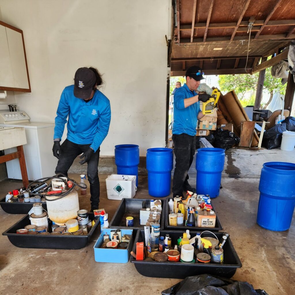 Hazawaytoday.com employees sorting and collecting hazardous waste materials into bins for removal in El Segundo, CA
