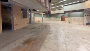 A large empty commercial space partially stripped for renovation by Crosslands Companies in Englewood, CO